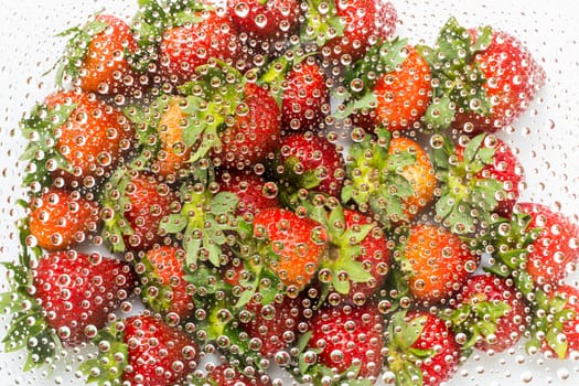 Water drop, droplet, raindrop of strawberry background