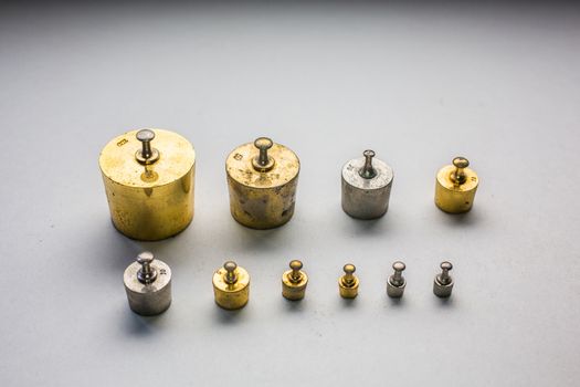 gold-colored brass weight set
