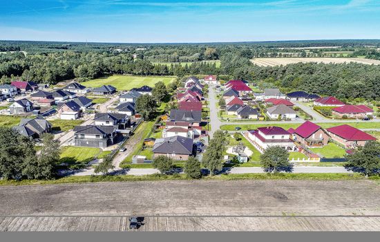 Aerial photo with the drone, anew build-up plot with single houses and gardens, narrow neighborhood