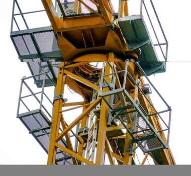 Cabin of a crane, shot from below, construction site