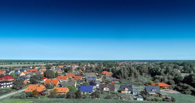 Aerial photo with the drone, anew build-up plot with single houses and gardens, narrow neighborhood