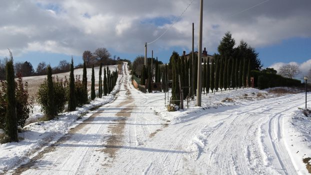 The countryside of Umbria near to Gubbio under the snow during the Winter - Beautiful landscape covered by snow in a sunny day