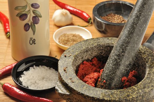 Harissa chili paste in a mortar with pestle