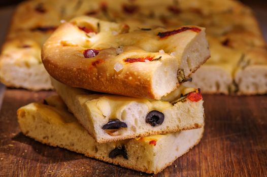 Focaccia with black olives, pepper, capers and rosemary