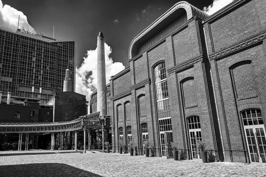 Facade of a renovated building of an old brewery in the city of Poznan, black and white