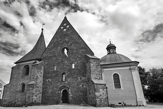 facade facade of a medieval, historic gothic church in Poznan, black and white