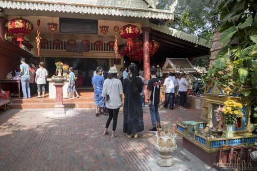 People at the entrance of a Chinese temple closed to Wat Phnom Temple at Phnom Penh, Cambodia, Asia