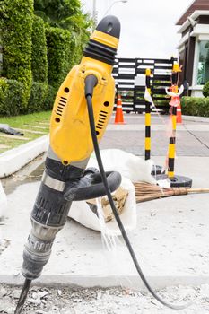 Ongoing roadwork under construction using jackhammer equipment