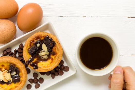 Traditional Portuguese egg tart to be eaten with coffee.