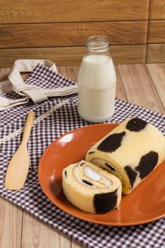 Cake roll with cow-skin pattern inserted with fresh milk cream.