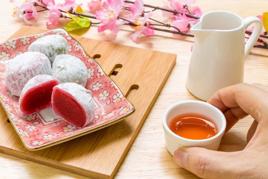 Daifuku traditional Japanese dessert eaten with tea background.