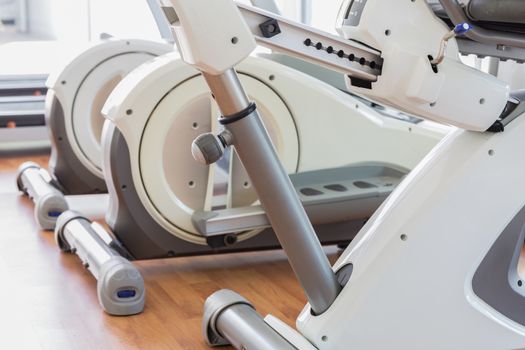 Row of elliptical cross trainer in gym