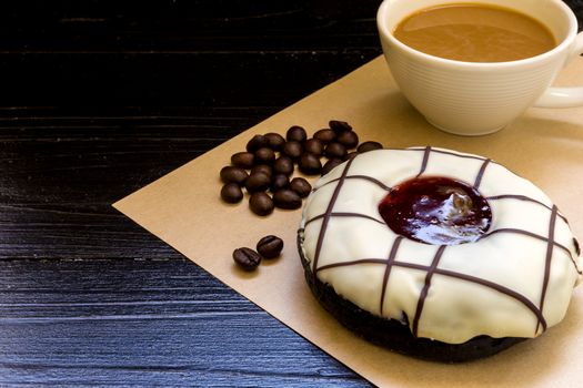 Fresh donut or doughnut with cup of hot coffee for relaxing moment.