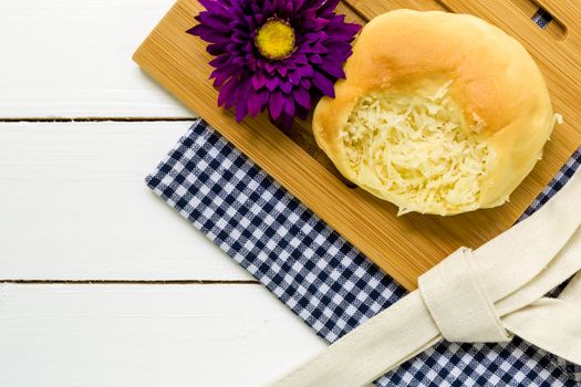 Coconut bun with cup of coffee for breakfast background.