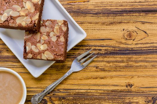 Chocolate almond brownie for relaxing coffee break.