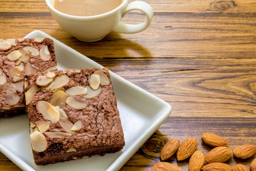 Chocolate almond brownie for relaxing coffee break.