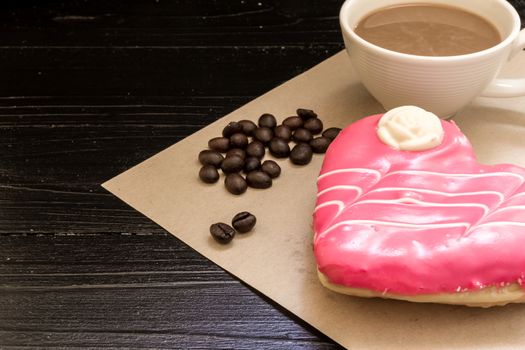 Fresh donut or doughnut with cup of hot coffee for relaxing moment.