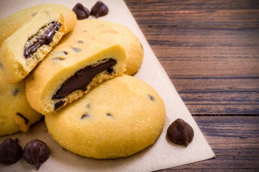 Freshly baked chocolate lava cookies on wooden background.