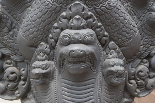 Details of a Mythical Seven-Headed Snake goddess, Khmer Naga sculpture, Buddhist temple Wat Preah Prom Rath in Siem Reap, Cambodia, Asia