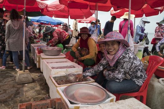 Krong Kaeb, Kep Province, Cambodia, 31 March 2018. Cambodian girls selling fresh shrimps at the Crab Market