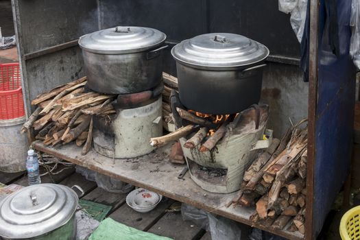 Fish cooking station on wood fire at the famous Crab Market of Kep, Cambodia