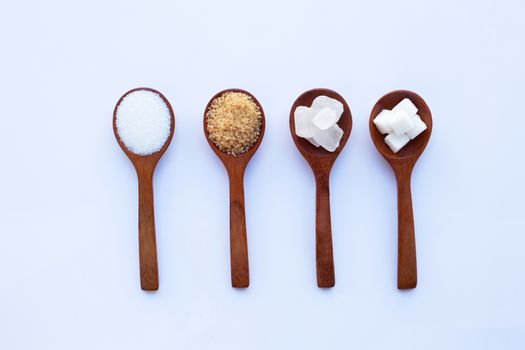 Various types of sugar on white background.