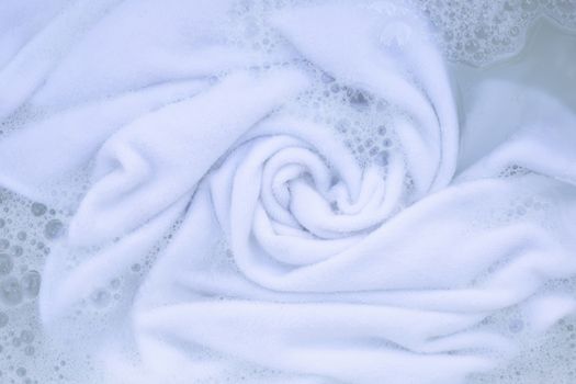 Soak a cloth before washing, white cloth