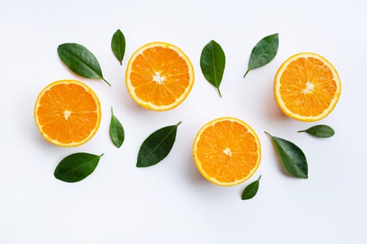 Top view of orange fruits and leaves isolated on white background.