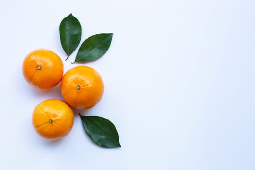Fresh orange citrus fruit with leaves isolated on white background.  Top view
