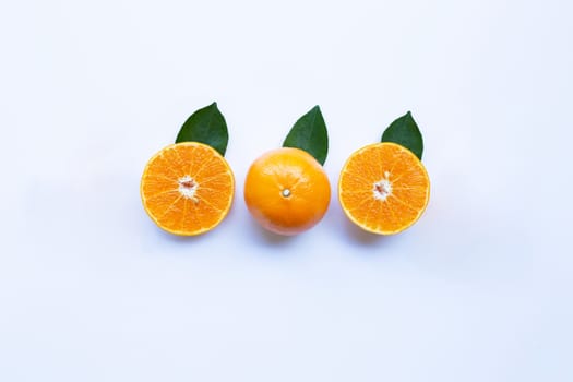 Fresh orange citrus fruit with leaves isolated on white background.  Top view