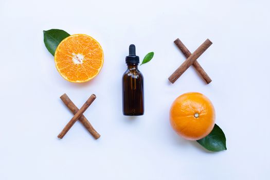 Essential oil with orange and cinnamon stick