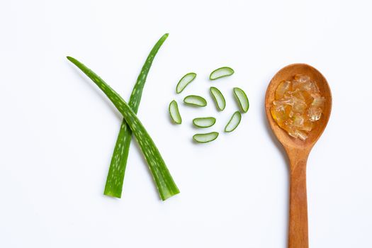 Aloe vera gel on wooden spoon with aloe vera on white background