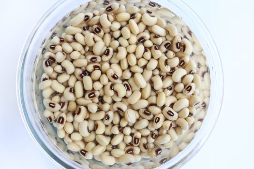 Black eyed beans soaked  in water in glass bowl