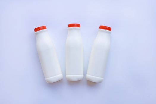 milk bottle on over white background