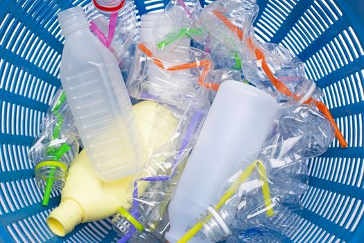 Plastic waste, Plastic bottles with straws in waste basket