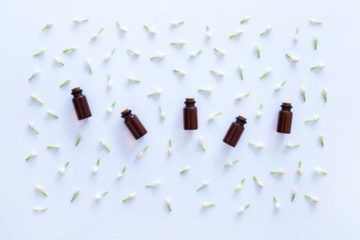 Essential oil with jasmine  flower on white background.