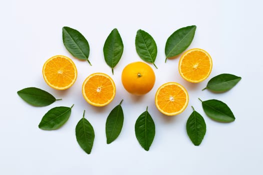 Fresh orange citrus fruit with leaves isolated on white background. Top view