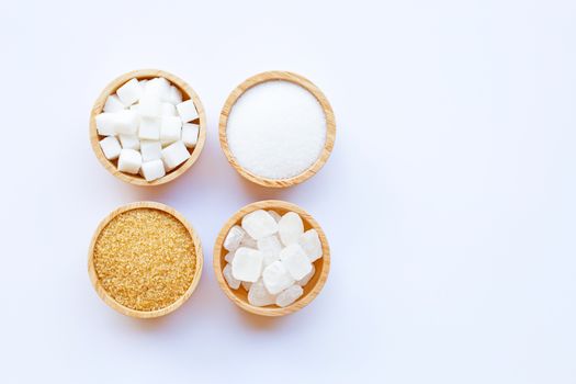 Various types of sugar on white background.