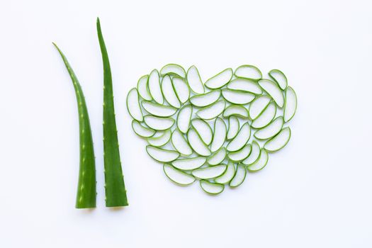 Aloe vera fresh leaf with aloe vera slices heart shaped on white background