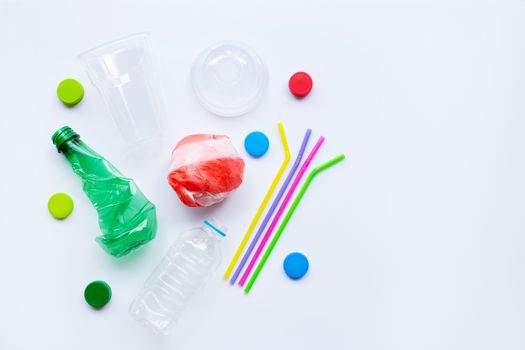 Plastic waste on white background. Top view
