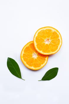 Fresh orange citrus fruits with leaves on white background.  Top view