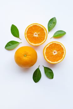 Fresh orange citrus fruit slices with leaves on white background.  Top view