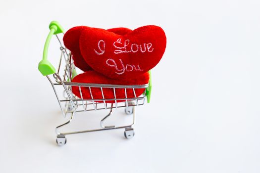 "I LOVE YOU" Red hearts in shopping cart on white background. Copy space, Concept background for Valentines Day 