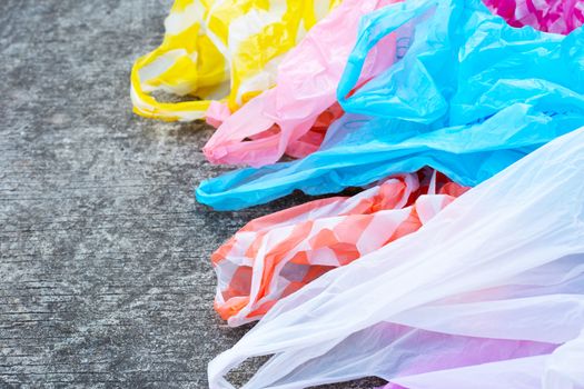 colorful plastic bags on cement floor
