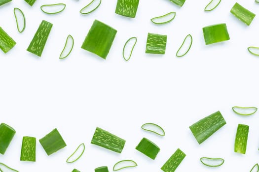 Frame made of Aloe Vera cut pieces with slices on  white background. Copy space