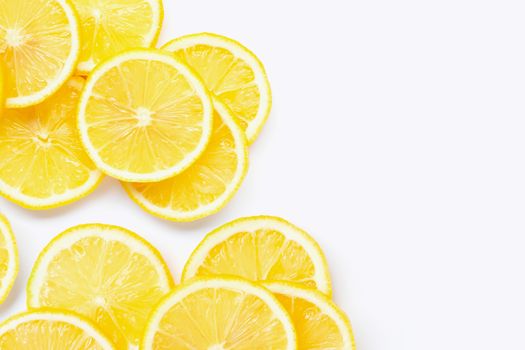 Fresh lemon with slices on white background.