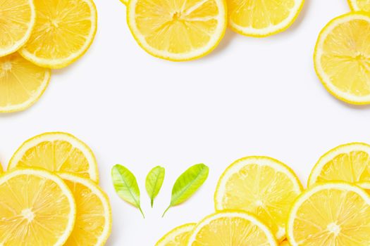Frame made of fresh lemon with slices on white background. Copy space