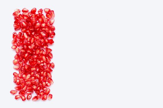 pomegranate seeds isolated on white background. Copy space