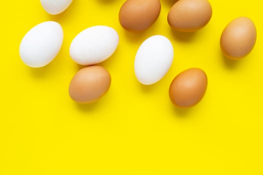 Eggs on yellow background.  Top view