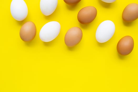 Eggs on yellow background.  Top view